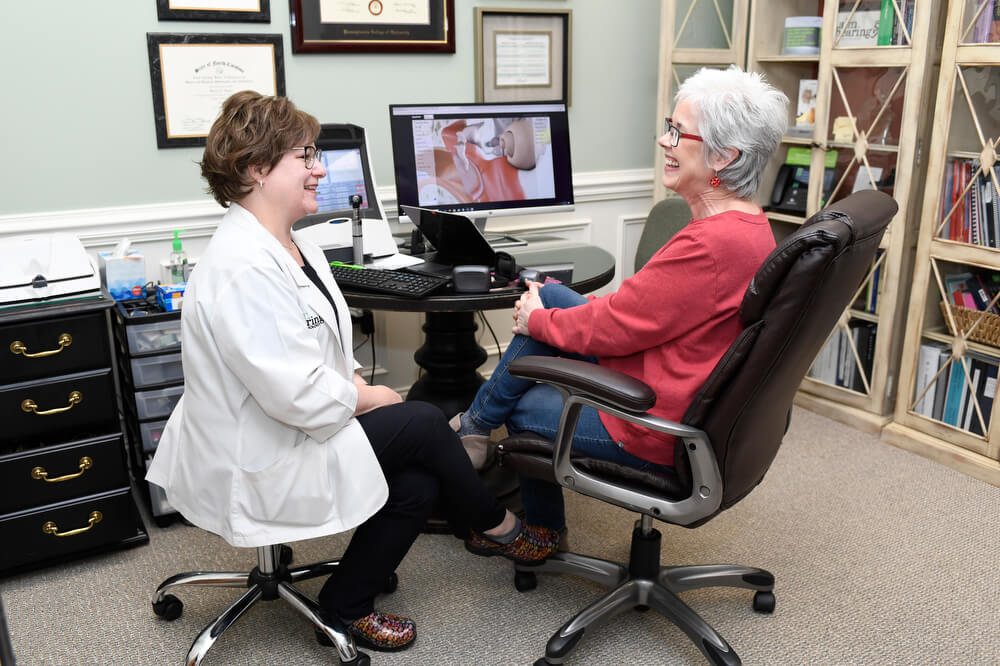 Audiologist with a senior female patient